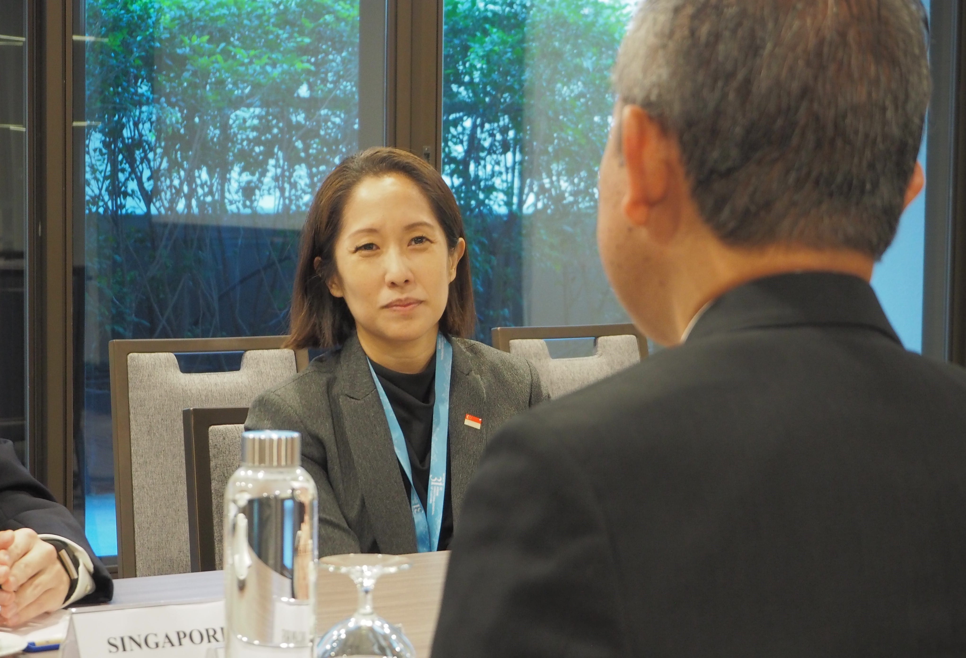 Two professionals in suits having a discussion